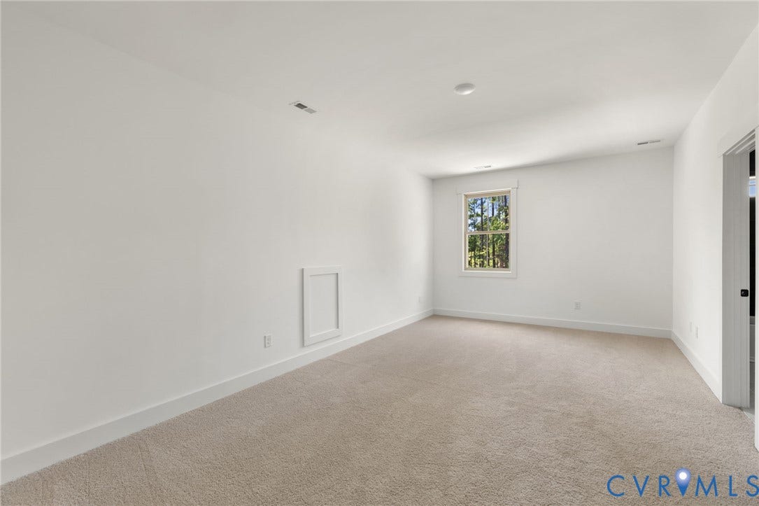 9514 Angels Share Drive, New Kent, VA 23141 Carpeted room with white walls, a single window, and a recessed ceiling light