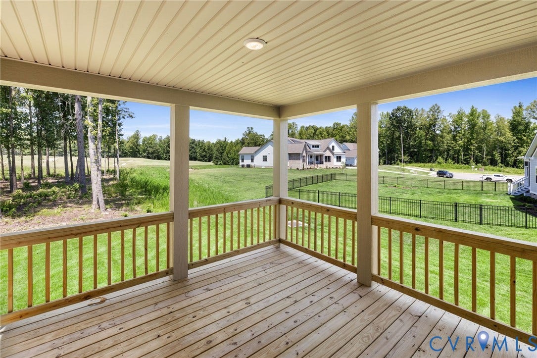 9514 Angels Share Drive, New Kent, VA 23141 Covered porch with wood decking, wood railings, and a soffit ceiling