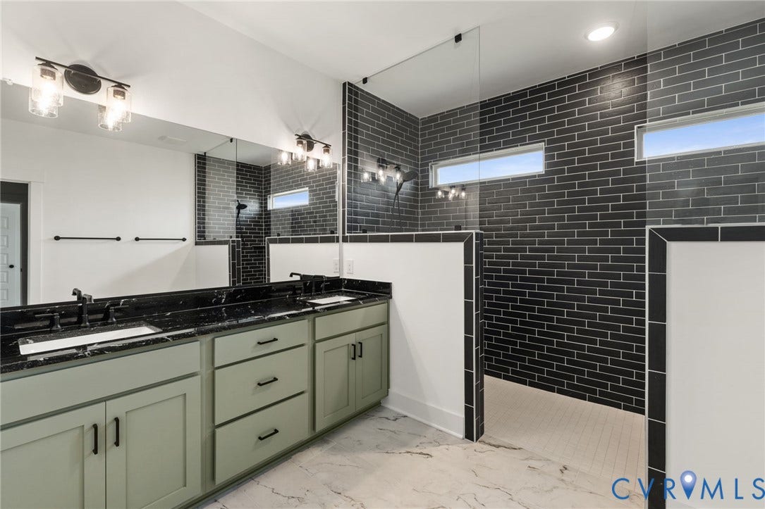9514 Angels Share Drive, New Kent, VA 23141 Dual vanity with light green cabinetry, black countertops, and undermount sinks