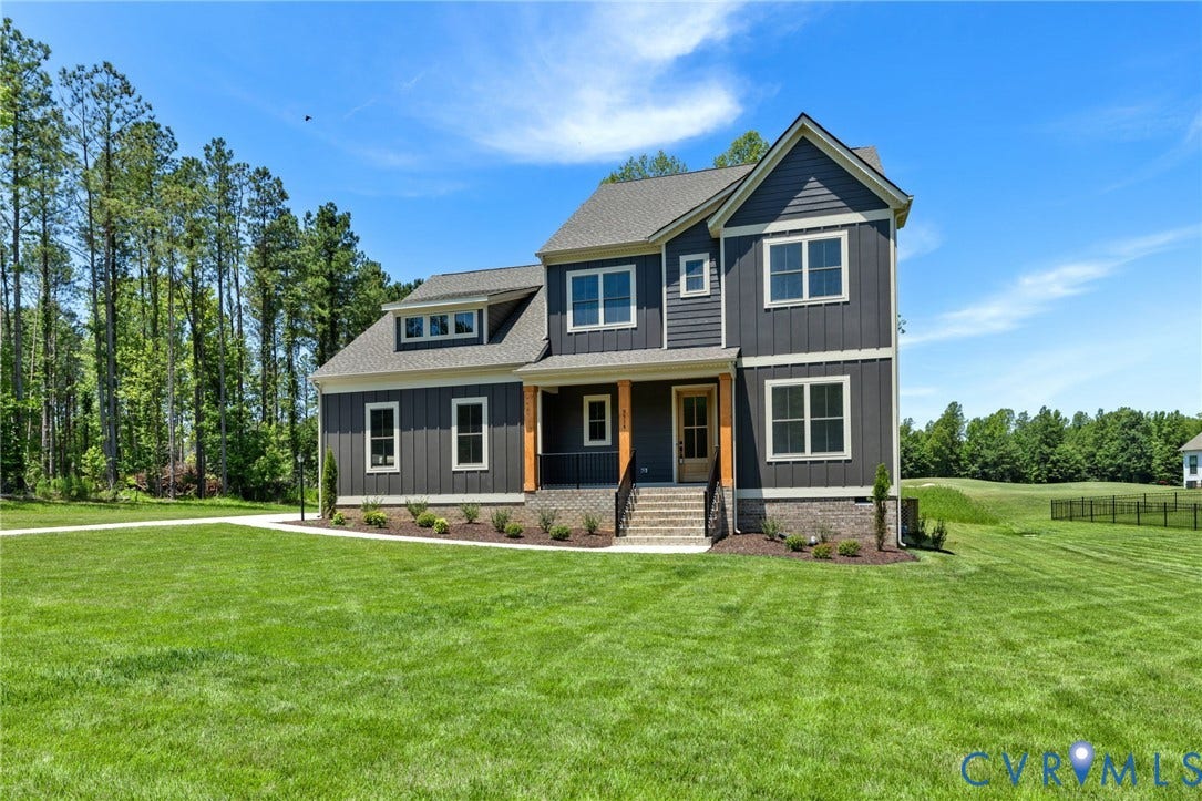 9514 Angels Share Drive, New Kent, VA 23141 Two-story exterior with board and batten siding, stone facade, covered front entry, and dormer window
