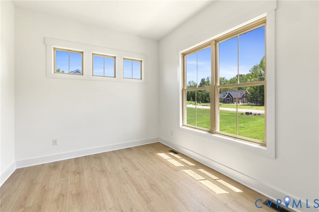 9514 Angels Share Drive, New Kent, VA 23141 Light-toned wood-finish flooring complements white walls