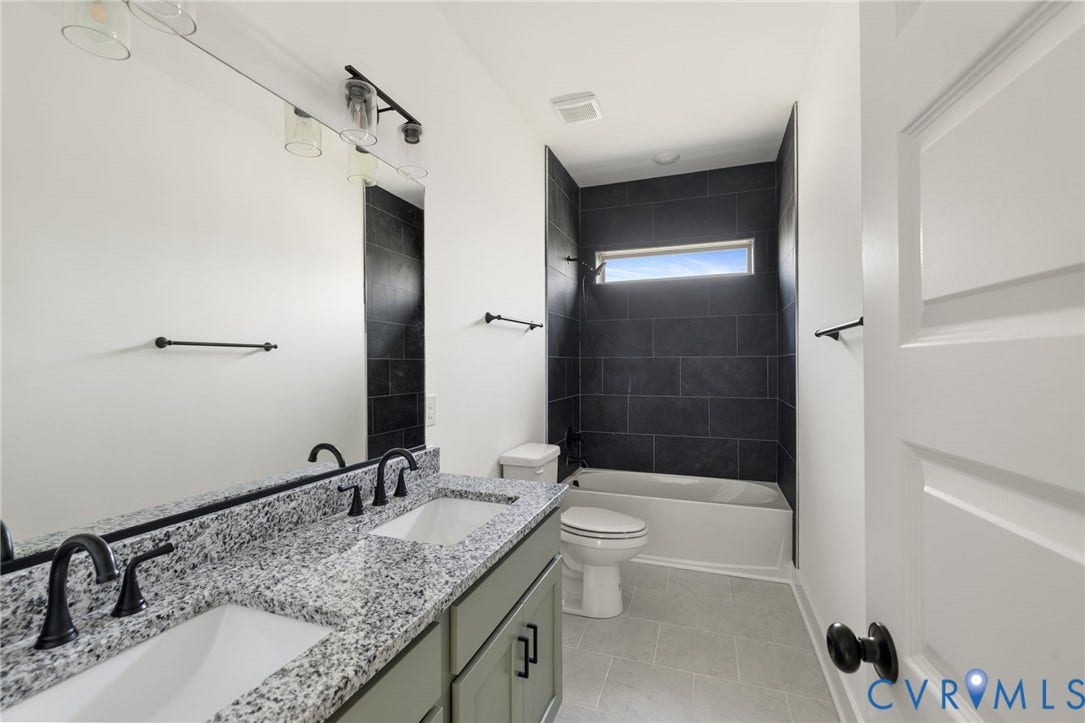 9514 Angels Share Drive, New Kent, VA 23141 Dual vanity with stone countertop, undermount sinks, and matte black fixtures