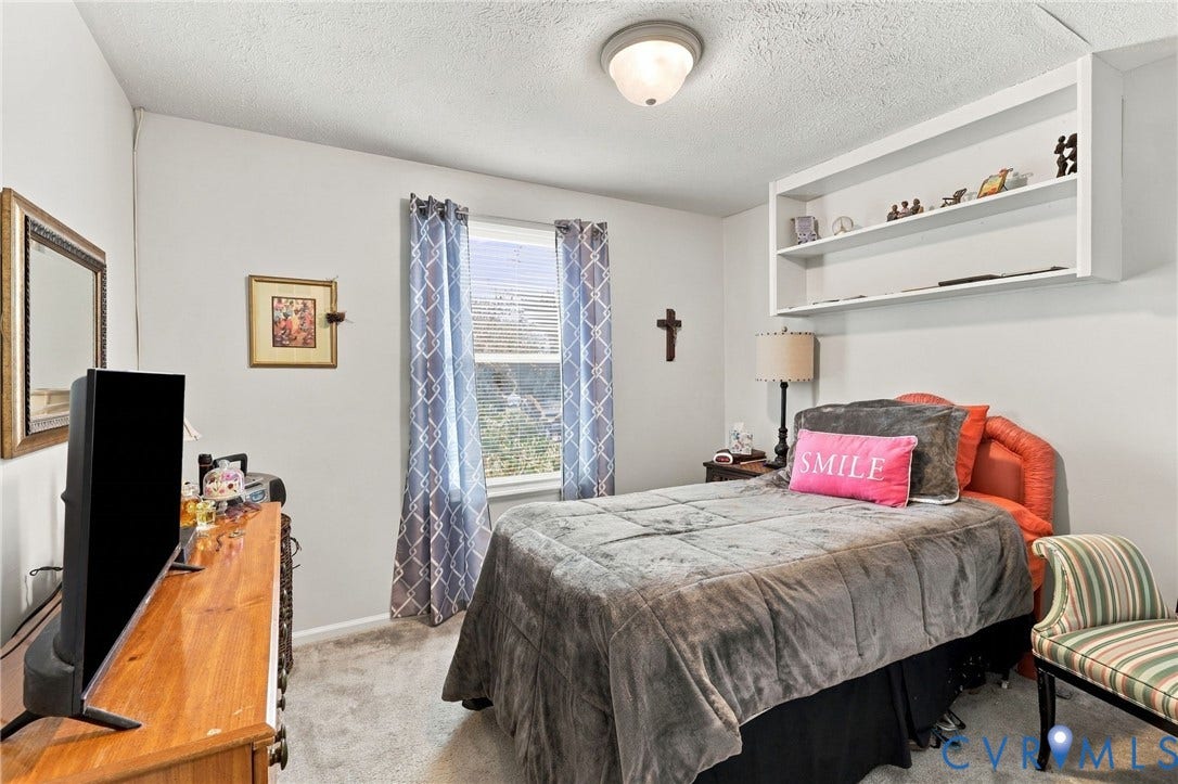 8434 Shannon Green Court, Henrico, VA 23228 Built-in wall shelving above the bed