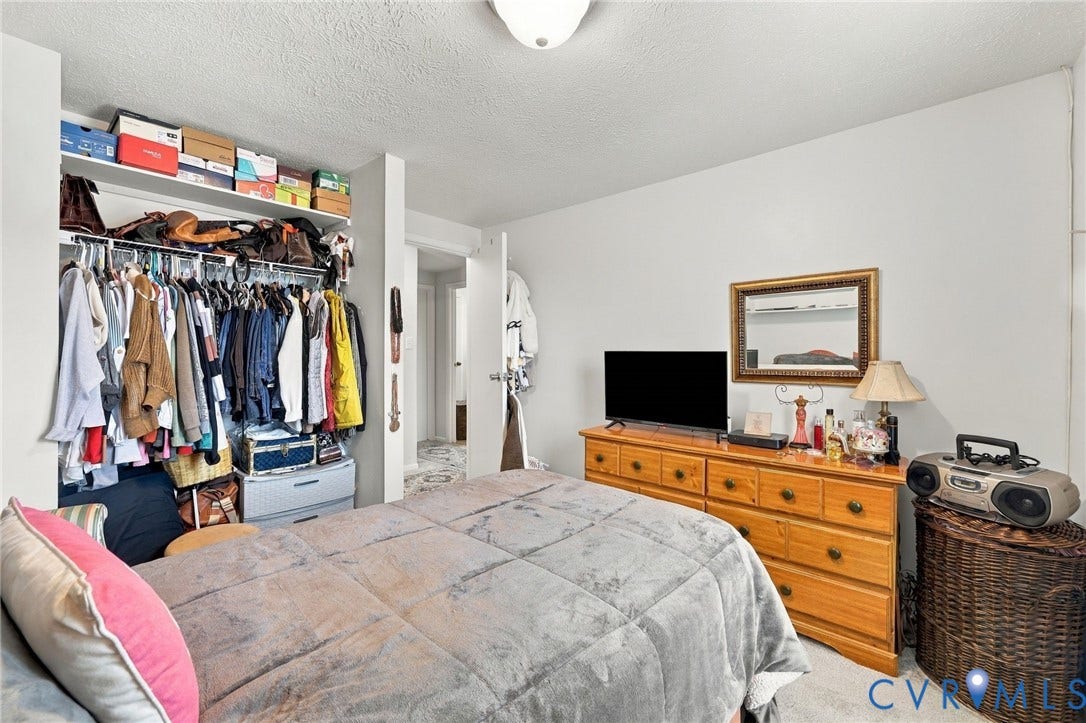 8434 Shannon Green Court, Henrico, VA 23228 Built-in closet with shelving and hanging rods