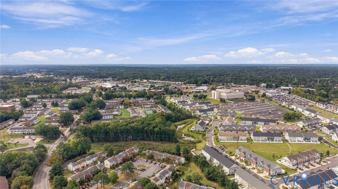 8434 Shannon Green Court, Henrico, VA 23228 Aerial perspective showcasing a residential community with mature trees and open green spaces