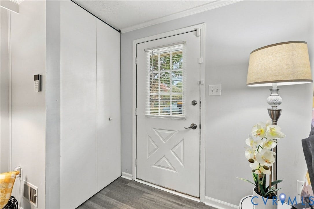 8434 Shannon Green Court, Henrico, VA 23228 White paneled door with integrated window blinds, wood-finish flooring, and crown molding