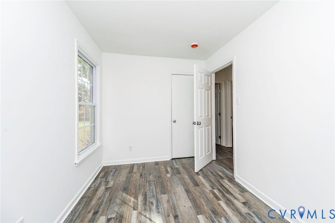 21108 Matoaca Road, Chesterfield, VA 23803 Wood-finish flooring, white paneled doors, and a double-hung window