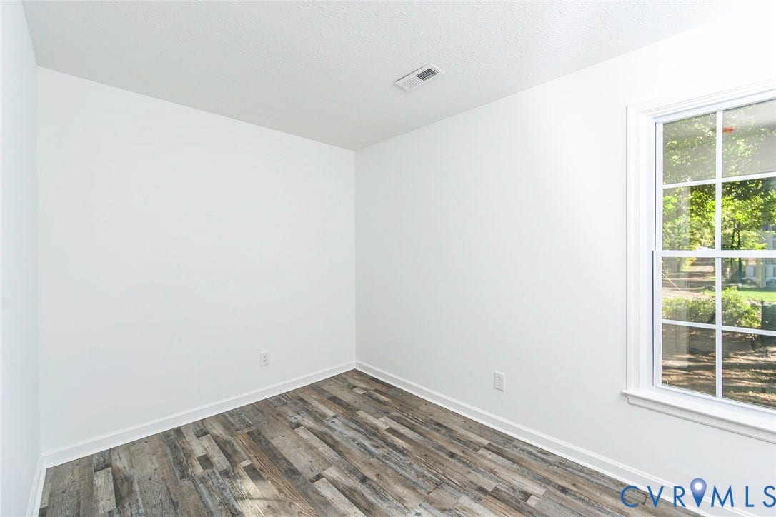 21108 Matoaca Road, Chesterfield, VA 23803 White walls, wood-finish flooring, and white trim