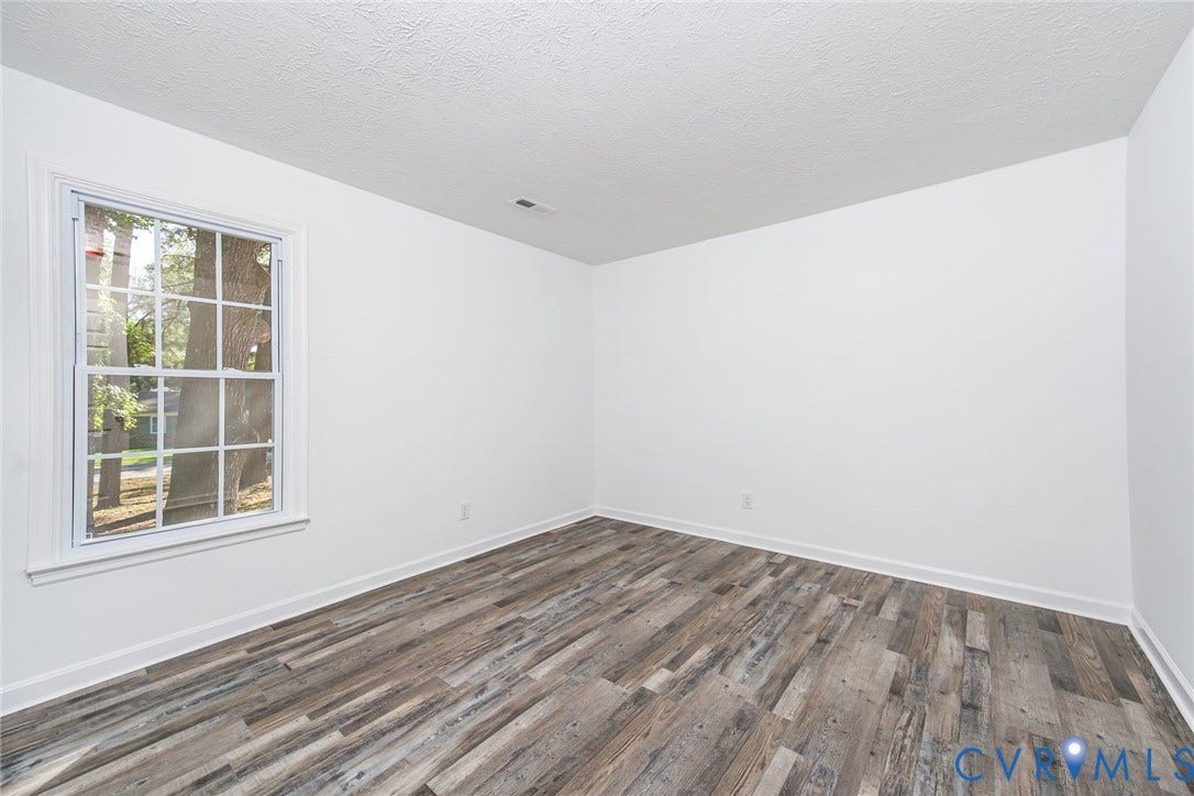 21108 Matoaca Road, Chesterfield, VA 23803 Bright interior featuring wood-finish flooring and a white trimmed window