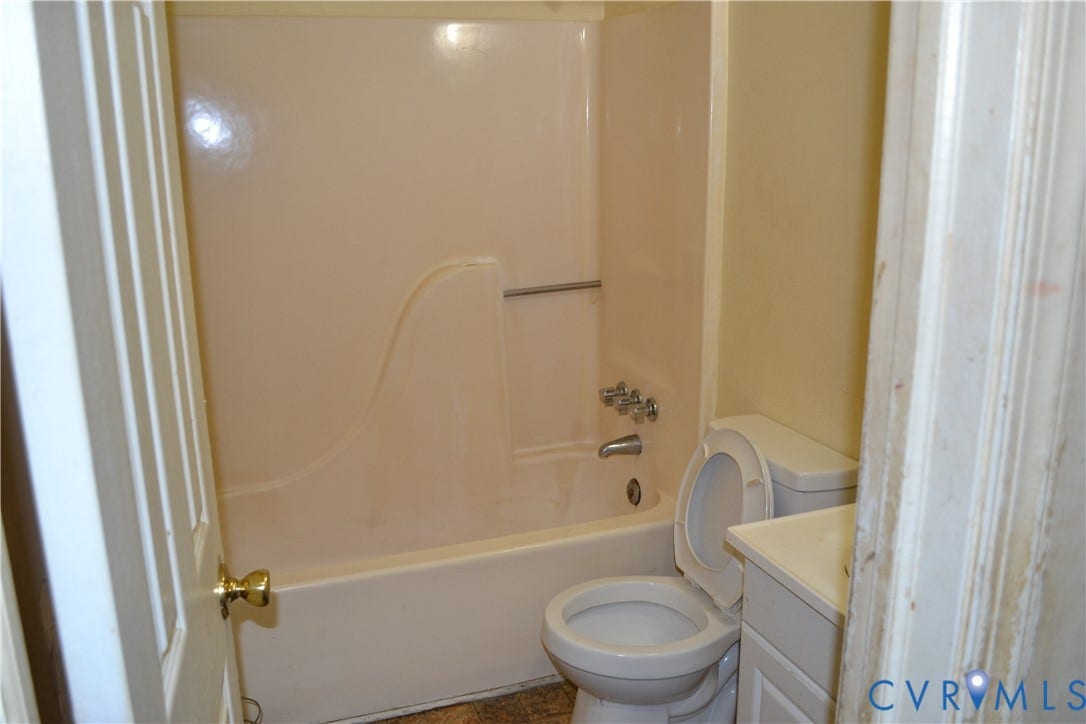 5207 Oakforest Drive, Chesterfield, VA 23832 Bathroom featuring a built-in tub and shower combination, chrome fixtures, and a white vanity with a countertop