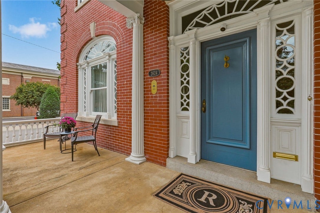 2624 Park Avenue, The Fan District, Richmond, VA 23220 Brick exterior with a prominent arched window and decorative balustrade