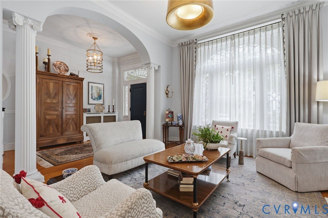 2624 Park Avenue, The Fan District, Richmond, VA 23220 Hardwood flooring, arched doorway, decorative columns, large window with custom window treatments