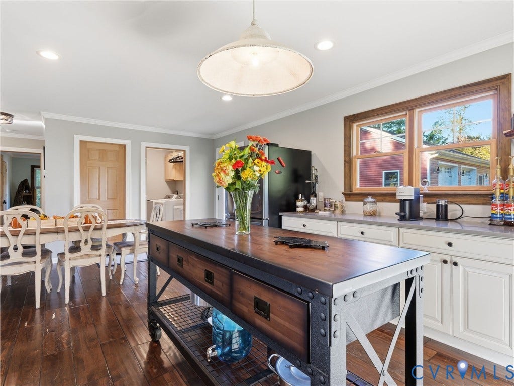 16233 Pleasant Mill Road, Montpelier, VA 23192 Kitchen featuring a mobile industrial-style island with a wood countertop, white shaker-style cabinetry, recessed lighting, and a pendant fixture over the workspace