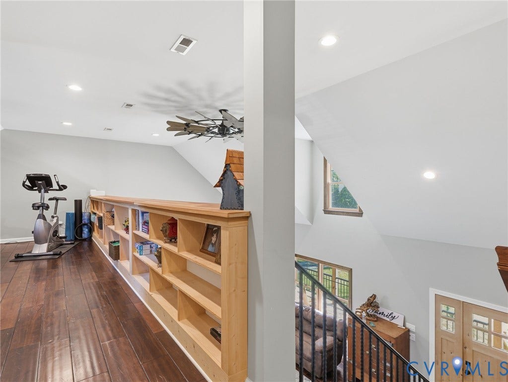 16233 Pleasant Mill Road, Montpelier, VA 23192 Upper level featuring wood-finish flooring, custom built-in wood shelving, recessed lighting, and a decorative industrial-style ceiling fan
