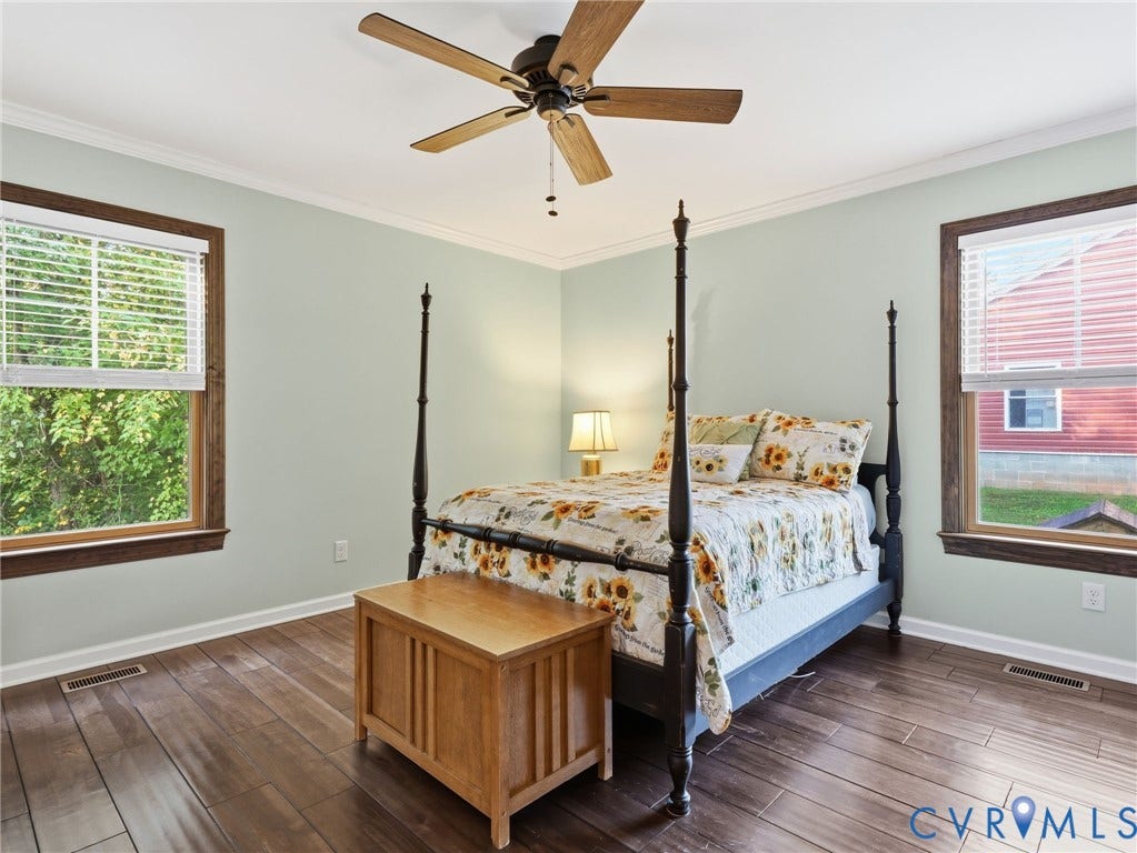 16233 Pleasant Mill Road, Montpelier, VA 23192 Wood-finish flooring, dual windows with dark-stained trim, and a ceiling fan with integrated lighting