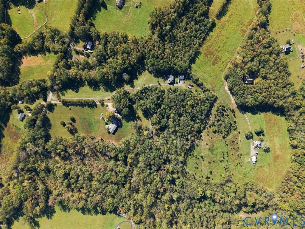 16233 Pleasant Mill Road, Montpelier, VA 23192 Aerial perspective of expansive acreage featuring mature woodland, open grassy fields, and private winding access roads