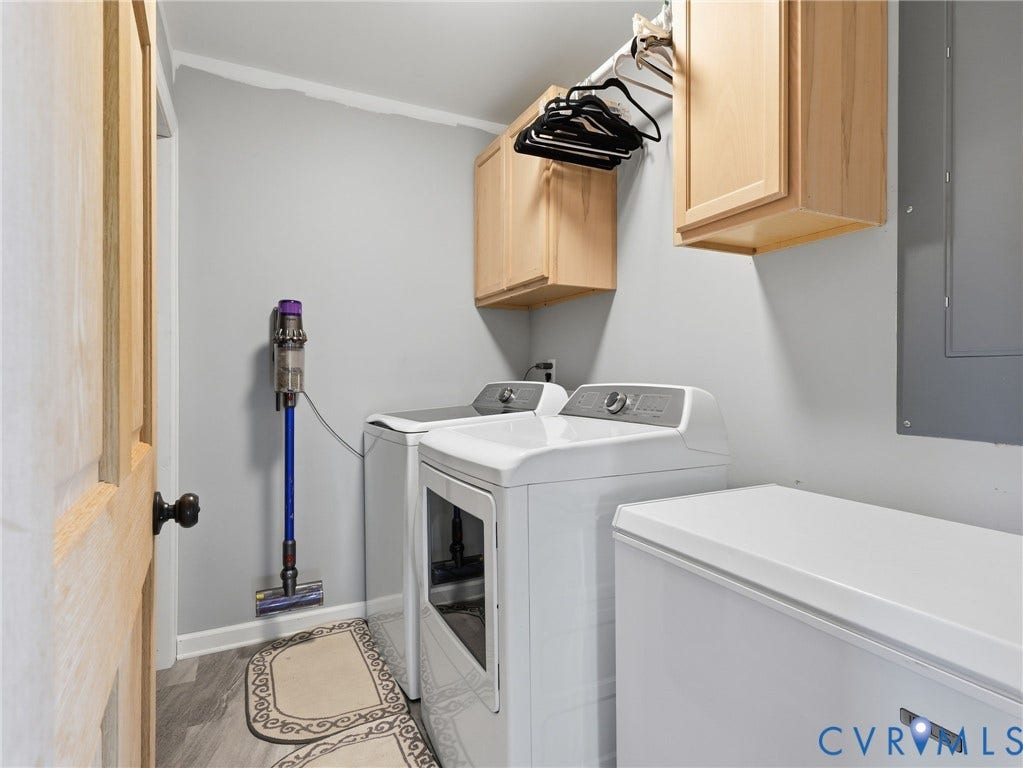 16233 Pleasant Mill Road, Montpelier, VA 23192 Utility area featuring wood-finish flooring, shaker-style light wood cabinetry, and a mounted metal clothing rod