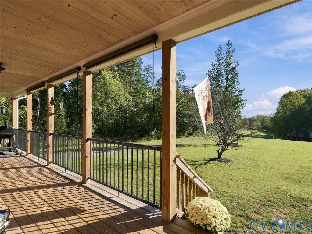 16233 Pleasant Mill Road, Montpelier, VA 23192 Covered porch featuring natural wood-finish decking, exposed wood plank ceiling, and metal railing
