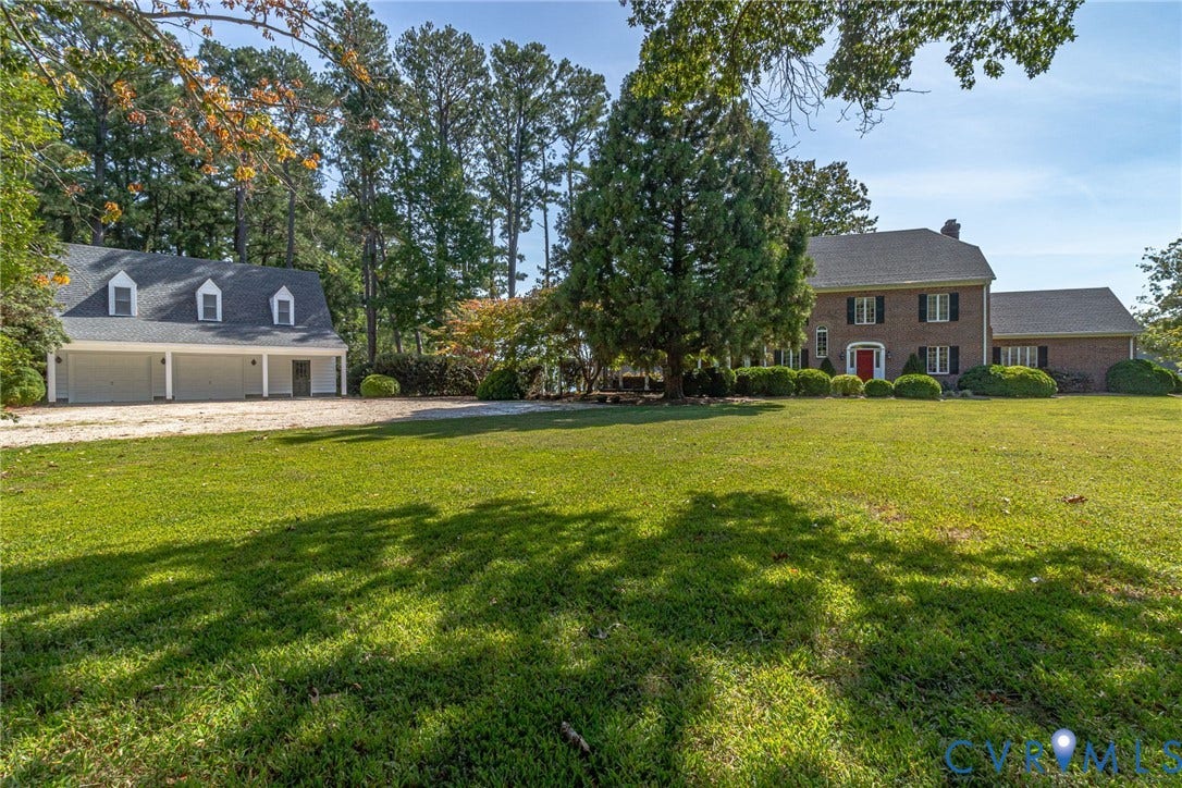 Expansive lawn with main house residence, oversized 2-car garage