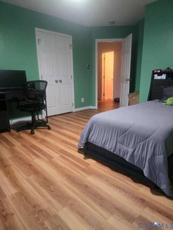 Wood-finish flooring throughout, bright wall paint, and white trim accents