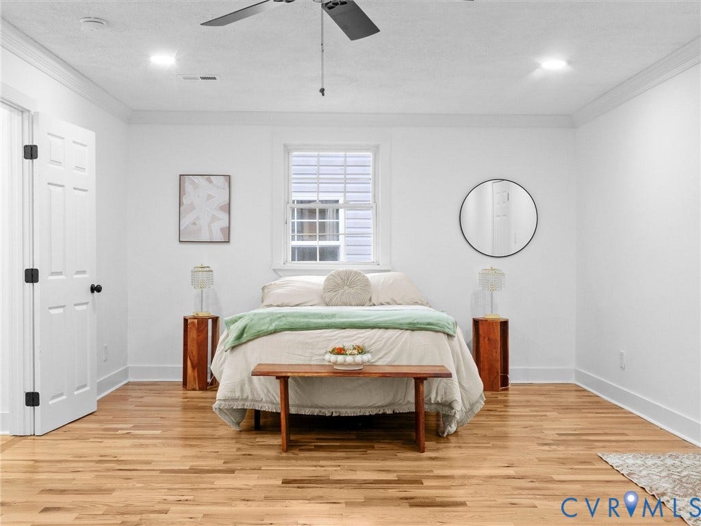 Recessed lighting, crown molding, wood-finish flooring, ceiling fan, and paneled interior door