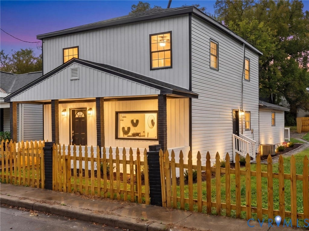 Two-story exterior with white vertical and horizontal siding
