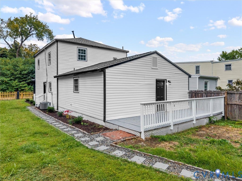 White siding exterior with black trim accents