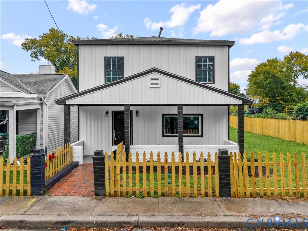 Two-story exterior with white vertical siding