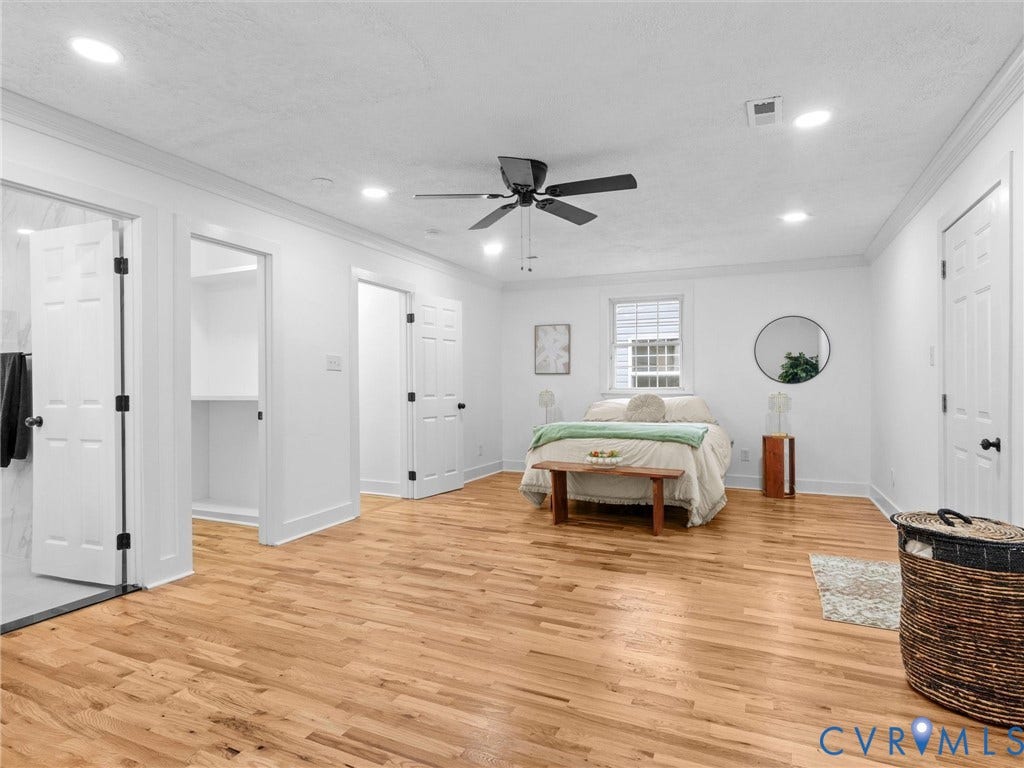 Recessed lighting, wood-finish flooring, ceiling fan, built-in shelving, and white paneled doors