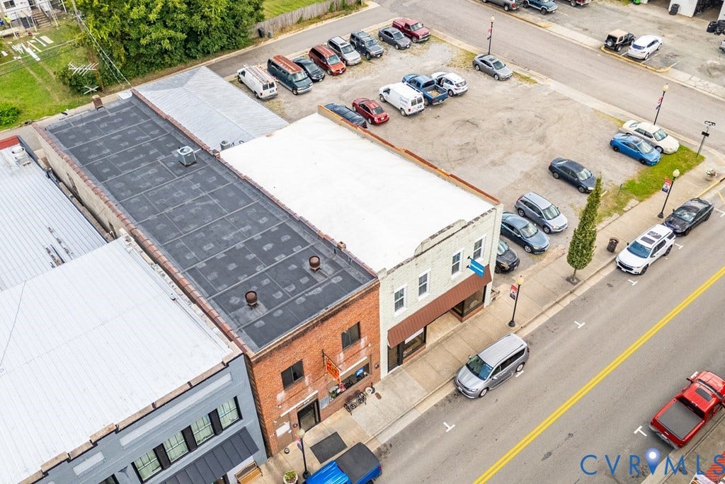 Brick building facade with multiple windows and a flat roof