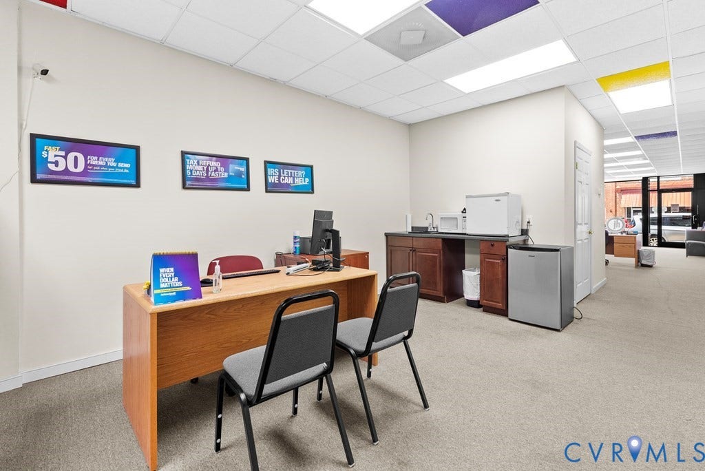 Built-in cabinetry with sink, recessed lighting, drop ceiling, and carpeted flooring