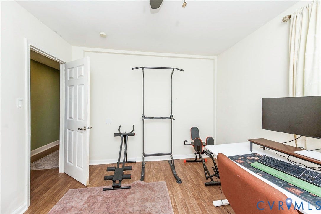 Wood-finish flooring throughout the room