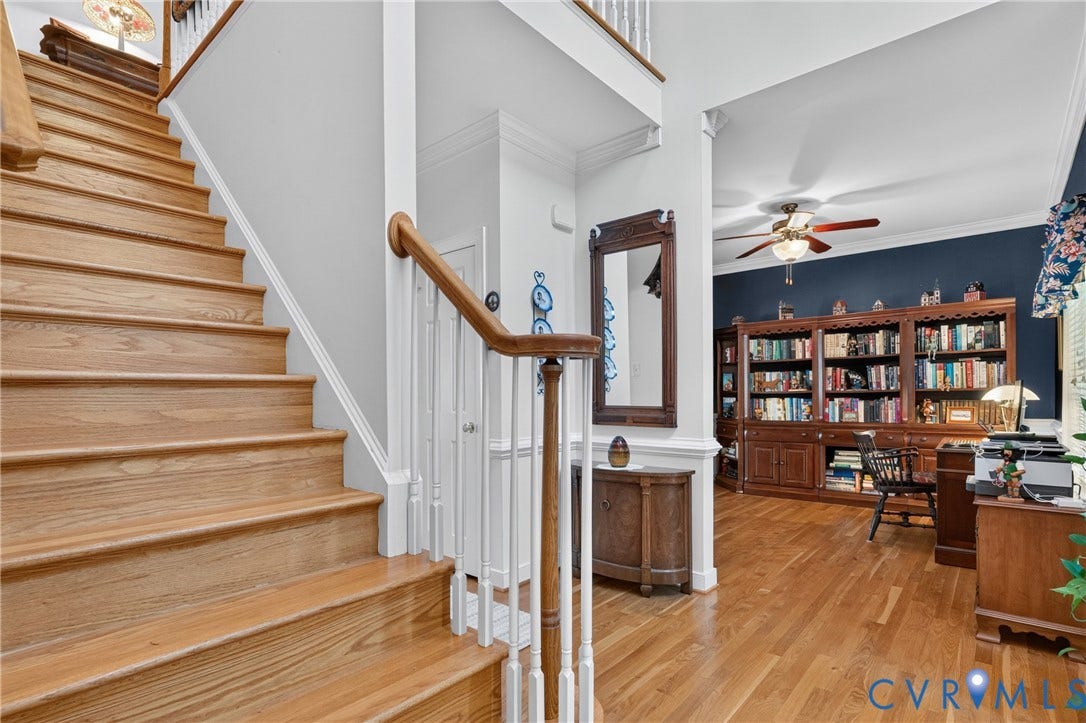 3647 Cedar Plains Road, Sandy Hook, Sandy Hook, VA 23153 Wood-finish flooring throughout, featuring a staircase with a wood handrail and white balusters