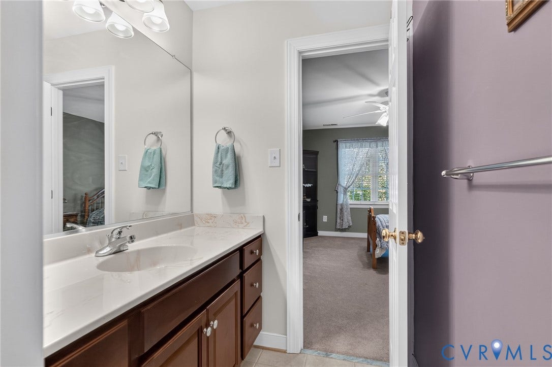 3647 Cedar Plains Road, Sandy Hook, Sandy Hook, VA 23153 Bathroom vanity with a single basin, polished chrome faucet, and integrated lighting