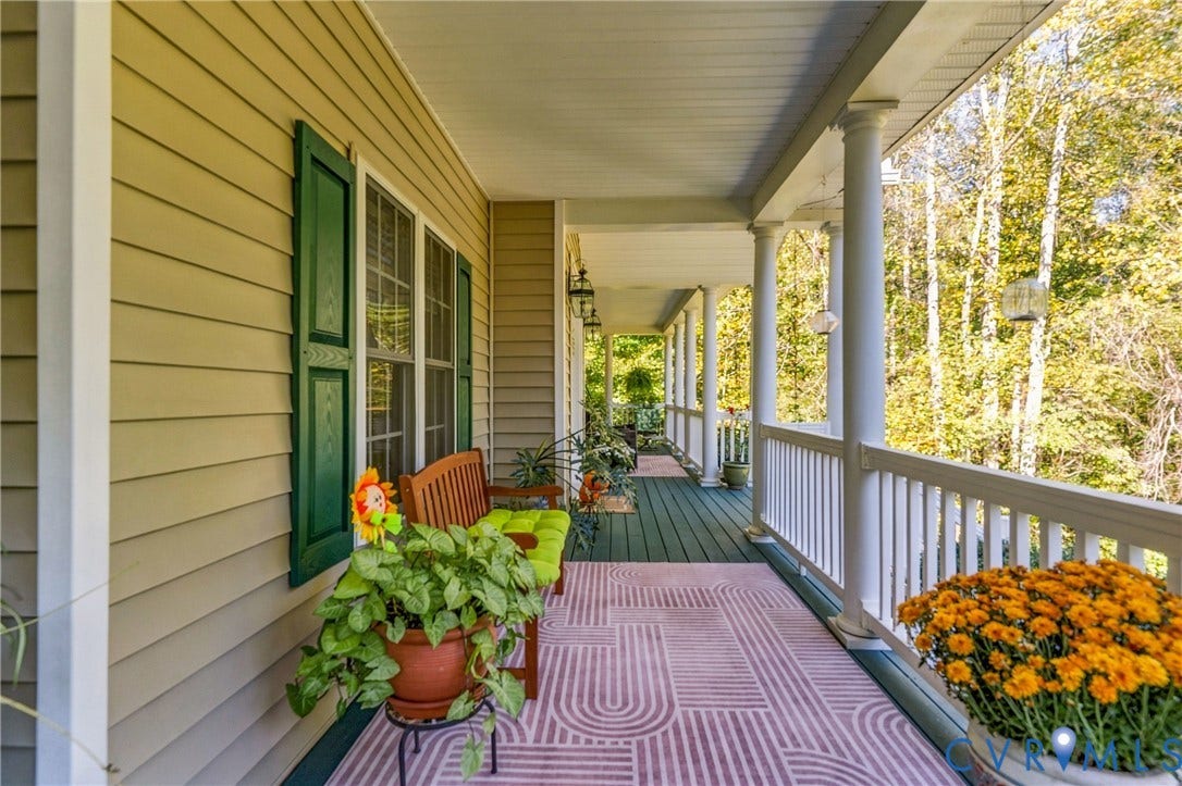 3647 Cedar Plains Road, Sandy Hook, Sandy Hook, VA 23153 Expansive porch featuring wood-finish flooring, white columns, and a railing system