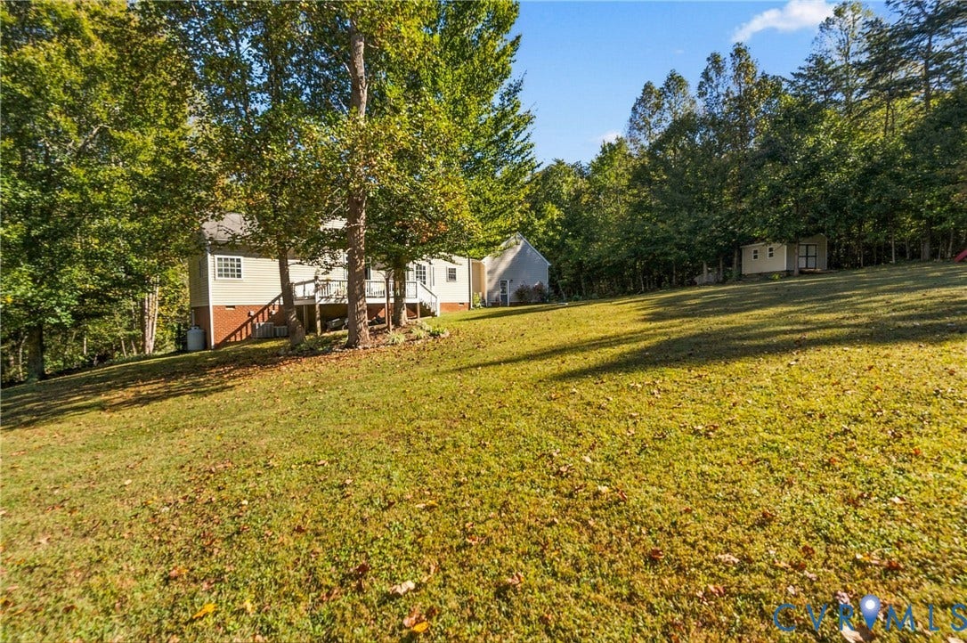 3647 Cedar Plains Road, Sandy Hook, Sandy Hook, VA 23153 Expansive green lawn with mature trees and a detached shed