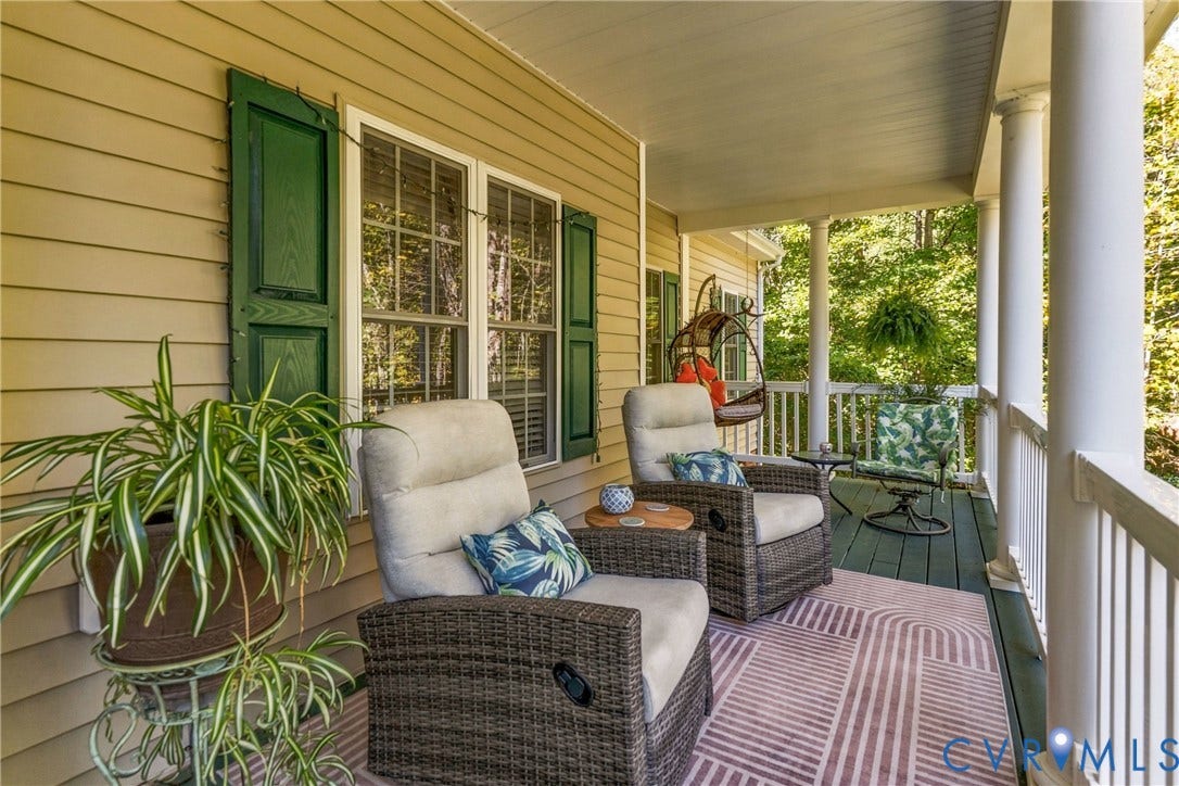 3647 Cedar Plains Road, Sandy Hook, Sandy Hook, VA 23153 Covered porch with white columns, green wooden shutters, and wood-finish flooring