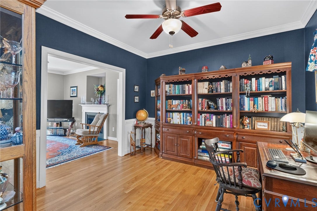 3647 Cedar Plains Road, Sandy Hook, Sandy Hook, VA 23153 Hardwood flooring, crown molding, and a built-in wood-finish bookcase