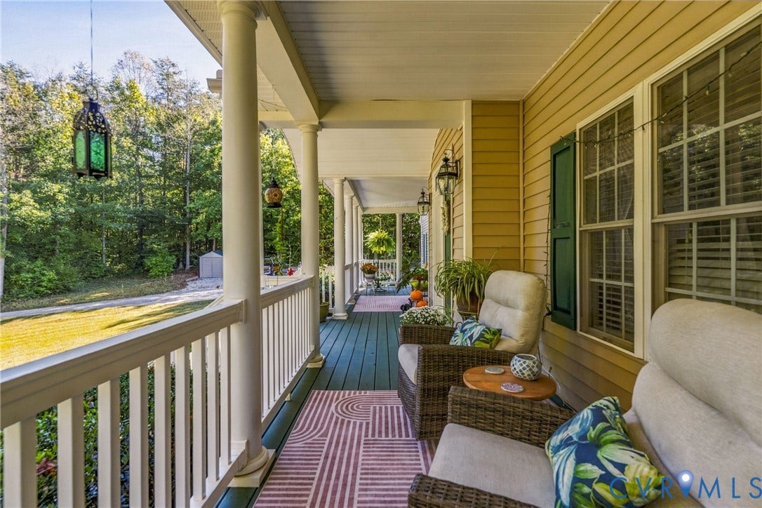 3647 Cedar Plains Road, Sandy Hook, Sandy Hook, VA 23153 Expansive covered porch with white columns, painted wood flooring, and horizontal siding