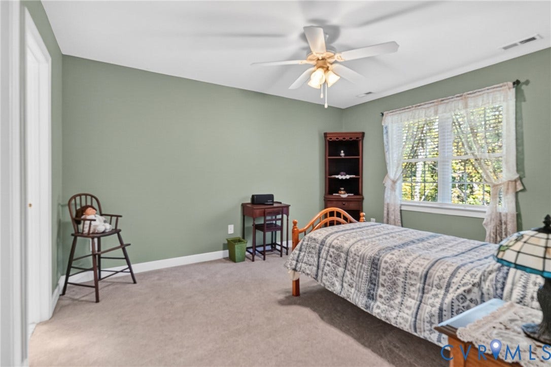 3647 Cedar Plains Road, Sandy Hook, Sandy Hook, VA 23153 Carpeted flooring, ceiling fan with light fixture, window with blinds, and built-in shelving unit