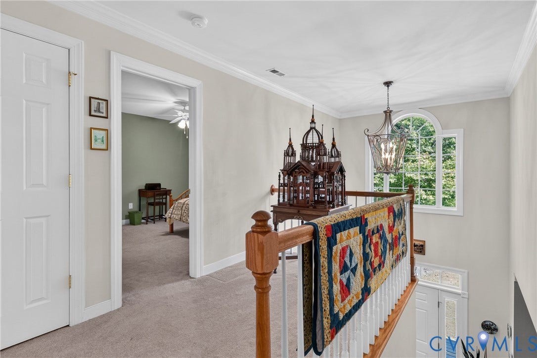 3647 Cedar Plains Road, Sandy Hook, Sandy Hook, VA 23153 Arch-top window, wrought iron-style chandelier, and carpeted flooring