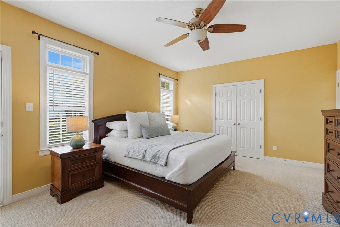 11813 Longfellow Drive, Bayhill Pointe, Midlothian, VA 23112 Room featuring neutral carpeting, dual double-hung windows, a ceiling-mounted fan with integrated light, and a double-door closet