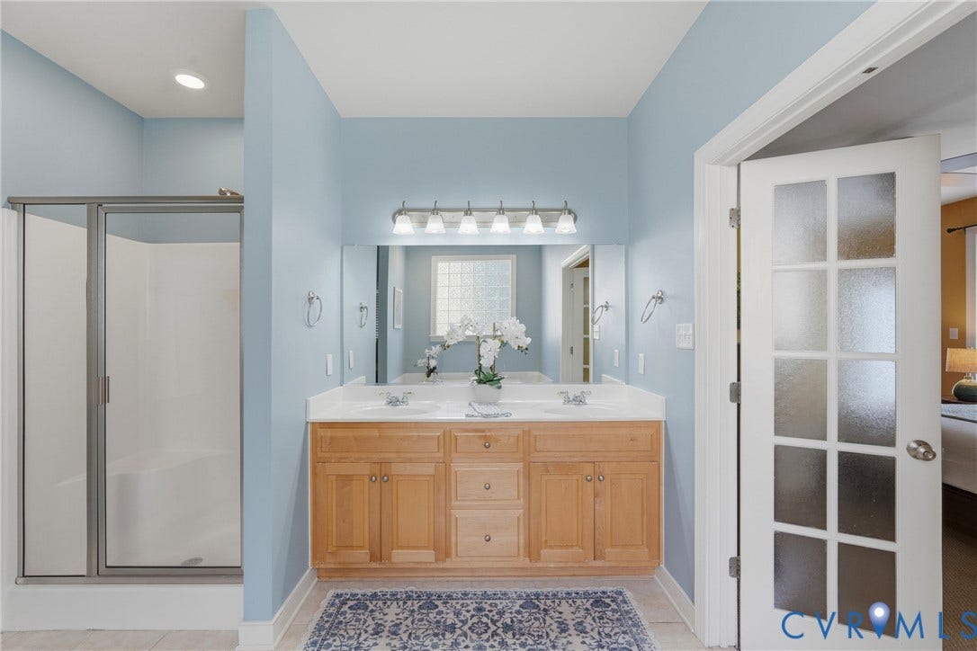 11813 Longfellow Drive, Bayhill Pointe, Midlothian, VA 23112 Double vanity with light wood cabinetry, white countertops, recessed lighting, and a glass-enclosed shower