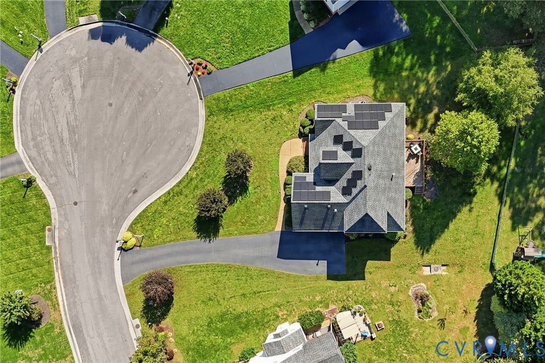 11813 Longfellow Drive, Bayhill Pointe, Midlothian, VA 23112 Aerial view of property featuring a shingled roof with integrated solar panels, asphalt driveway, and expansive lawn area