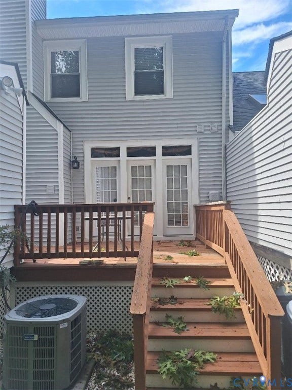 Light gray siding exterior with white window trim
