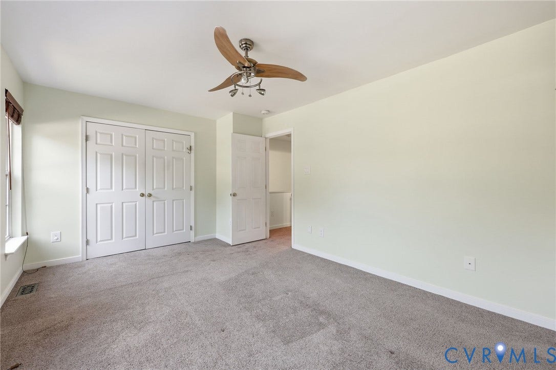 2803 Queensland Drive, #2803, Pemberton Oaks, Glen Allen, VA 23294 Interior room featuring wall-to-wall carpeting, a multi-paneled double closet, and a ceiling fan with integrated light fixture