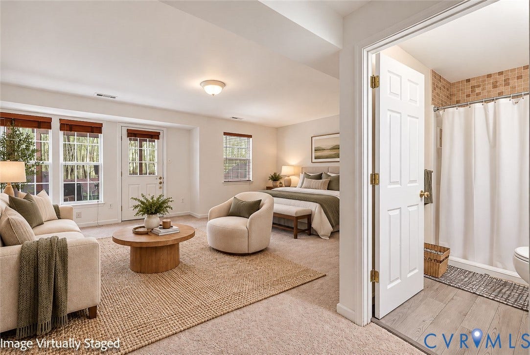2803 Queensland Drive, #2803, Pemberton Oaks, Glen Allen, VA 23294 Neutral-toned carpeted flooring, multiple oversized windows, exterior-access door, and a tiled shower enclosure with wood-finish flooring