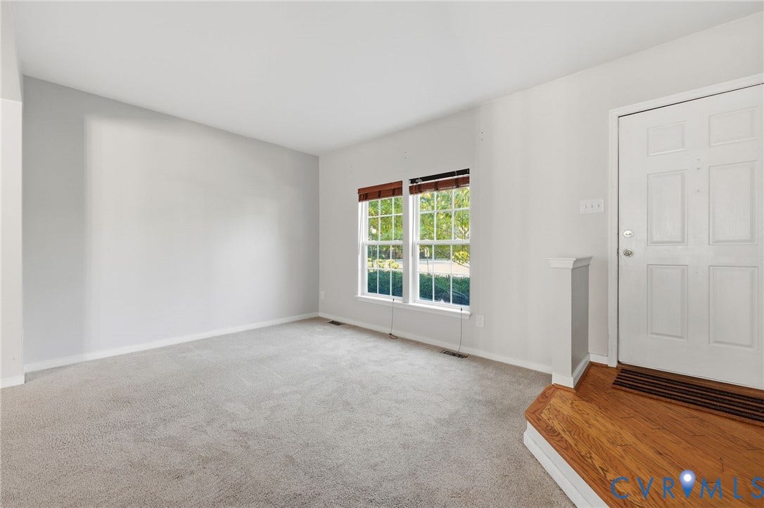 2803 Queensland Drive, #2803, Pemberton Oaks, Glen Allen, VA 23294 Neutral wall palette with plush carpeting, two double-hung windows, and a multi-pane entry door featuring a hardwood-finished platform landing