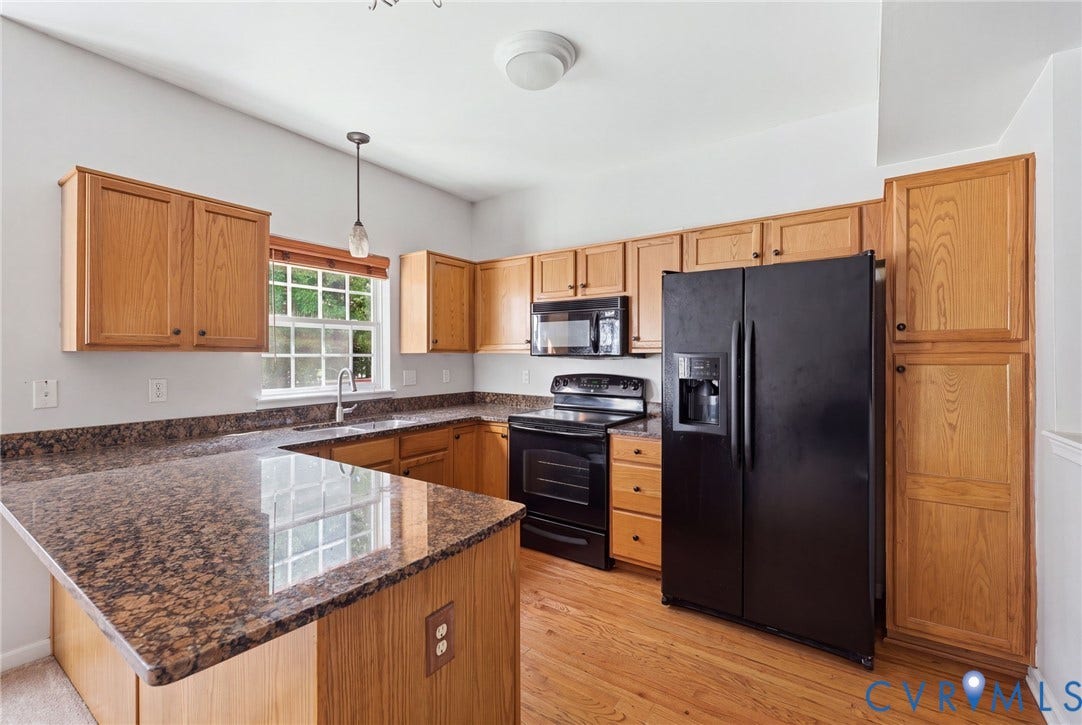 2803 Queensland Drive, #2803, Pemberton Oaks, Glen Allen, VA 23294 Kitchen featuring wood cabinetry, stone countertops, wood-finish flooring, and black appliances
