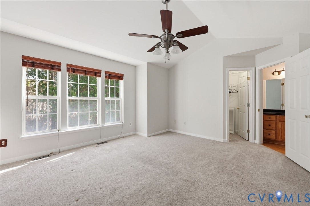 2803 Queensland Drive, #2803, Pemberton Oaks, Glen Allen, VA 23294 Vaulted ceiling featuring a central multi-blade ceiling fan, wall-to-wall carpeting, and a triple-window configuration with integrated wooden blinds